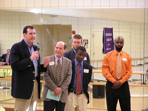 Our House Director Benny Bienvenue (second from left) with County Council President Mike Knapp (left).