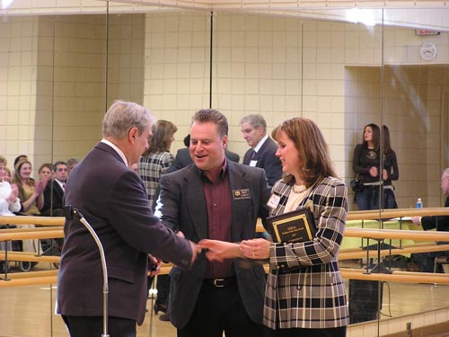 Roy Peck (left) accepts award from Del. Roger Manno and GOCA President Barbara Falcigno.