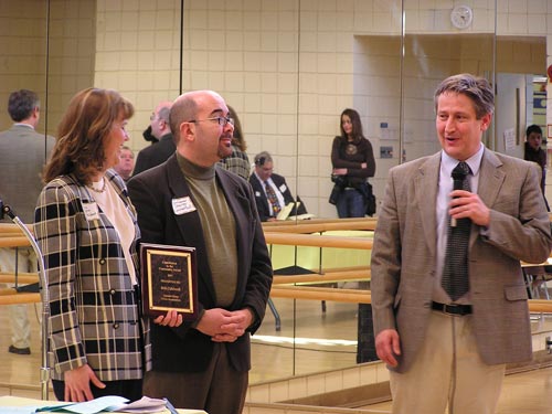 President Barbara Falcigno and County Council Member George Levanthal present award to William Caldwell (right).