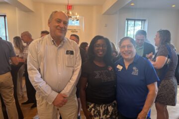 Smiling people in a crowded room